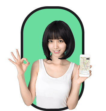 A woman looking to hire holding up a phone and showing the thumbs up sign.