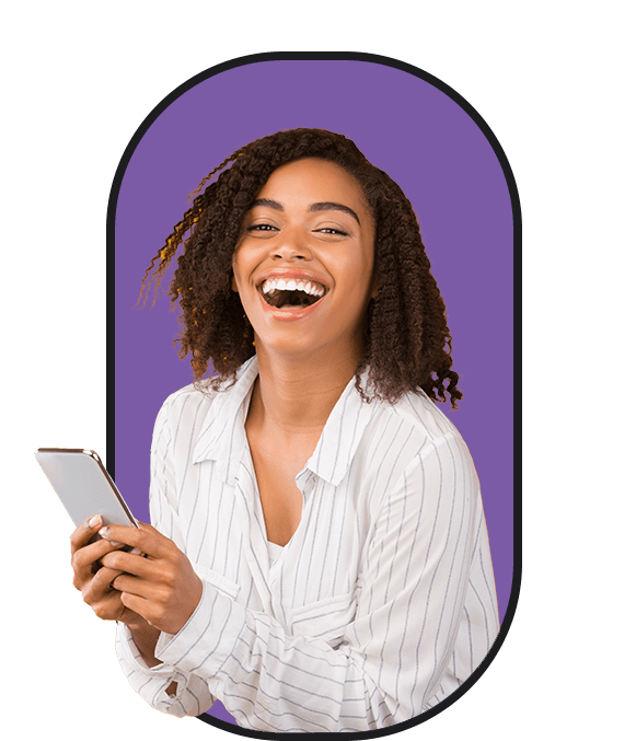 A woman laughing while holding a cell phone, looking to hire.