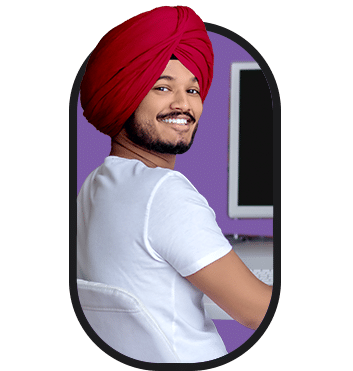 A man in a turban exploring job opportunities online.