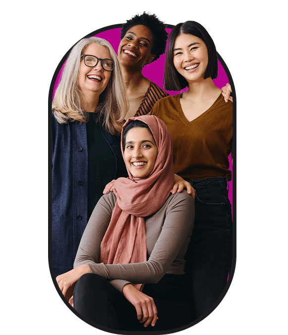 A group of women with hijabs posing in front of a pink background, representing inclusive employment opportunities for new arrivals.